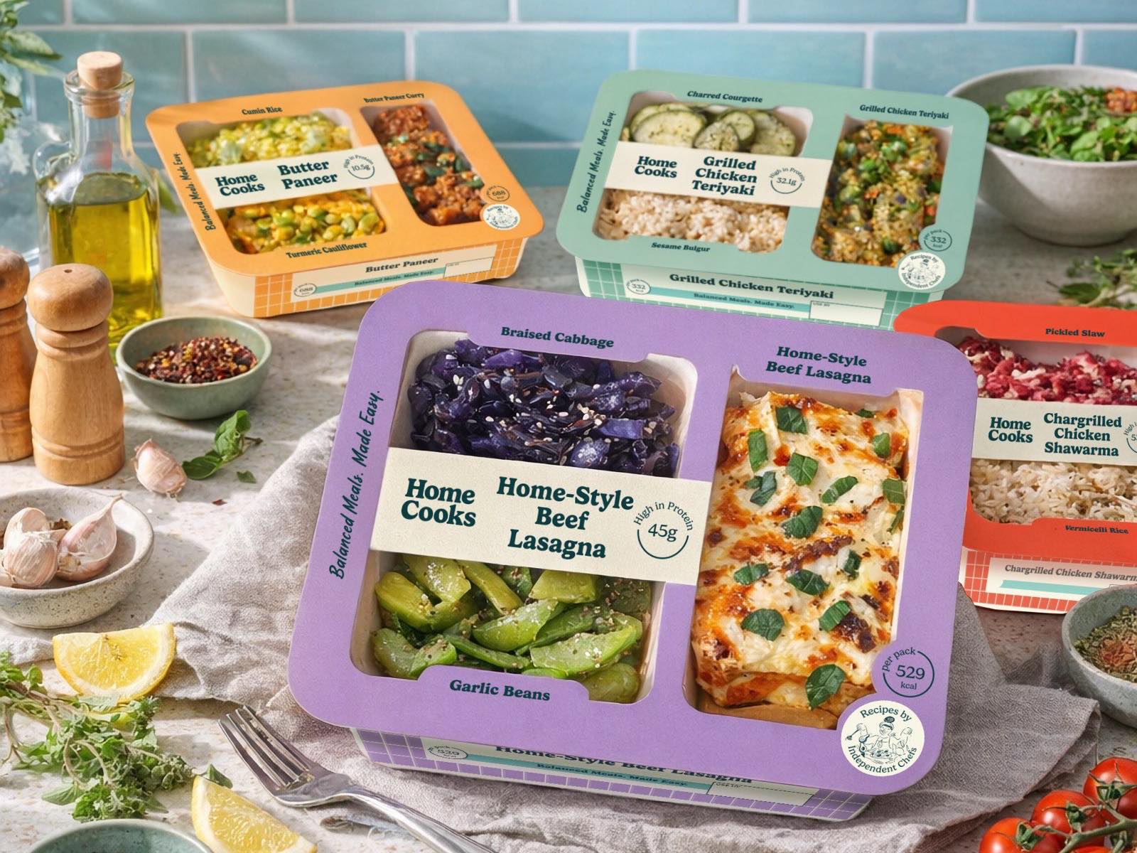 HomeCooks bento meals surrounded by fresh ingredients